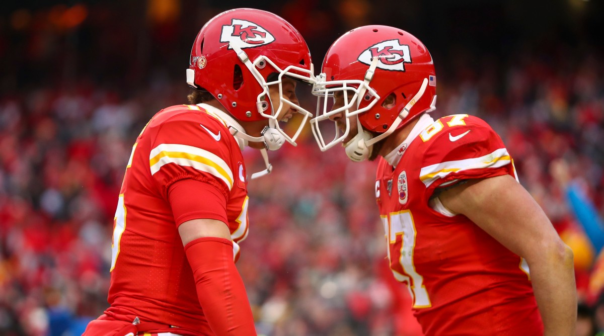 Kansas City Chiefs quarterback Patrick Mahomes (15) and tight end Travis Kelce (87) celebrate a touchdown against the Houston Texans during the second quarter in a AFC divisional round playoff game.